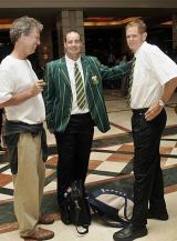 Mickey Arthur and Shaun Pollock wait in the hotel lobby as the South Africans prepared to leave Colombo &copy; AFP