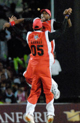Sherwin Ganga and Dwayne Bravo celebrate another Jamaican wicket as Trinidad and Tobago win the Stanford 20/20 © Stanford 20/20