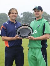 Jeroen Smits and William Porterfield share the trophy after the final was washed out in Belfast &copy; AFP